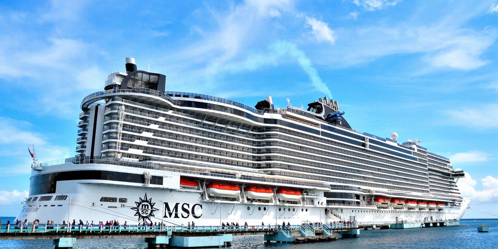 MSC Seascape cruise ship docked at a pier with MSC branding visible on the hull