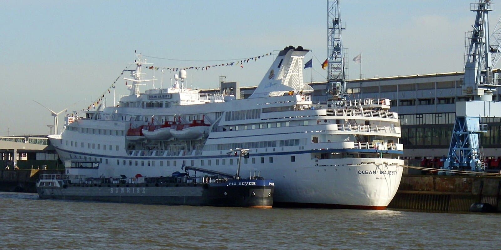 Cruise ship Ocean Majesty at sea with open water visible around the hull