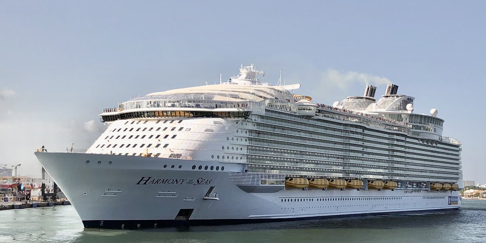 Harmony of the Seas at sea, starboard profile showing Royal Caribbean funnel and hull branding
