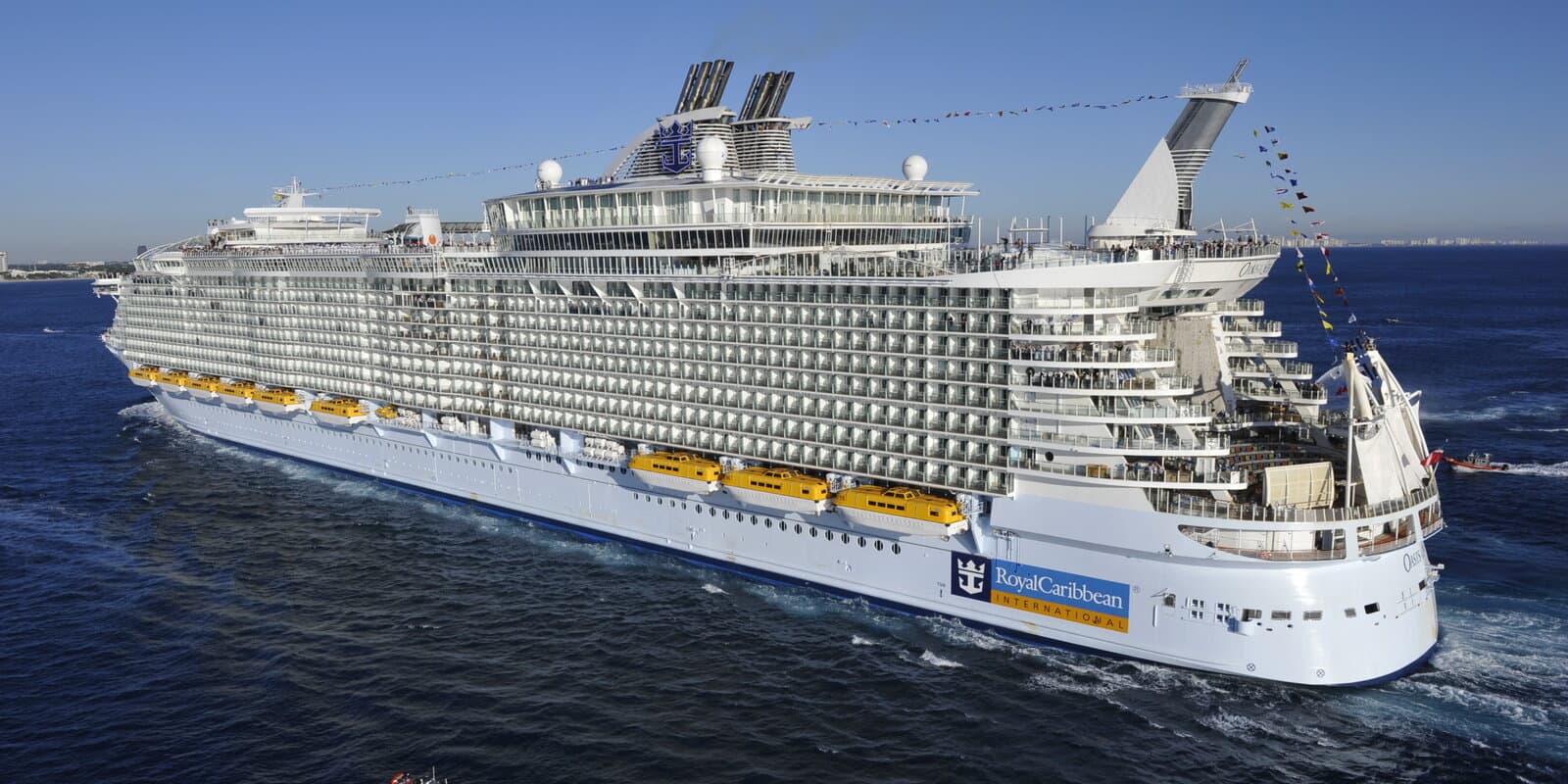 Oasis of the Seas cruise ship arriving at Port Everglades under Coast Guard escort