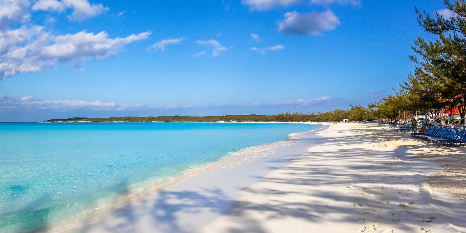 White sand beach and turquoise water along the shoreline at Half Moon Cay in the Bahamas