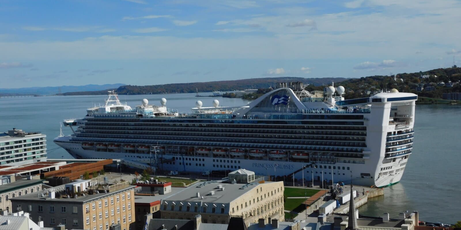 Caribbean Princess cruise ship at a quay in Quebec City, showing the Princess Cruises hull profile and funnel branding