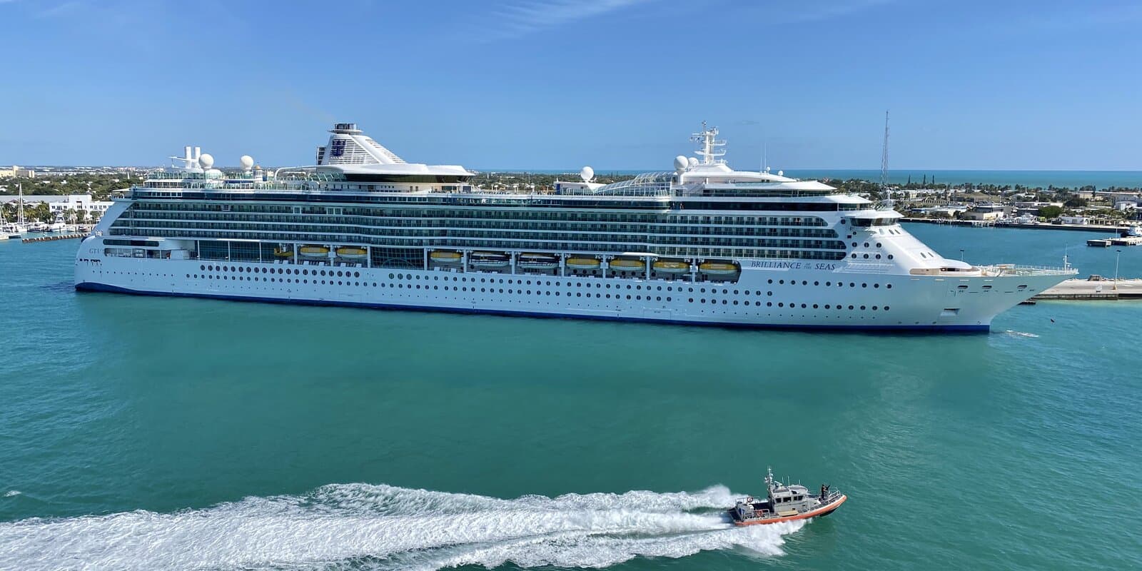 Brilliance of the Seas docked at Key West with Royal Caribbean hull branding and the ship name visible on the bow