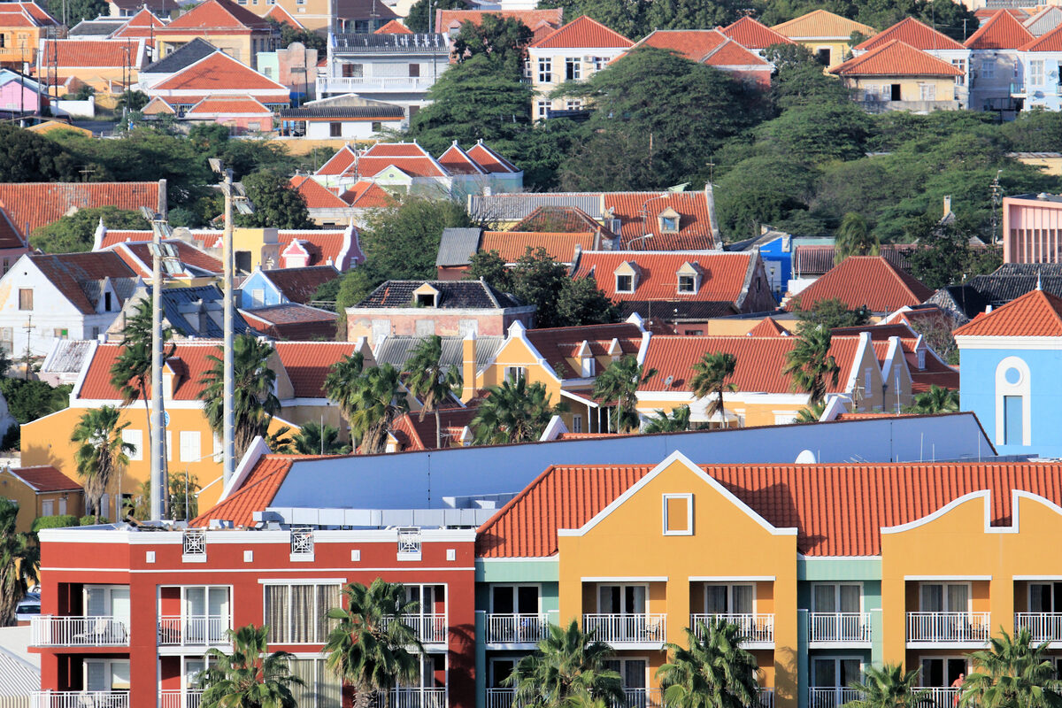 Colorful Dutch colonial buildings and terracotta roofs in Willemstad, Curaçao, viewed from the cruise pier