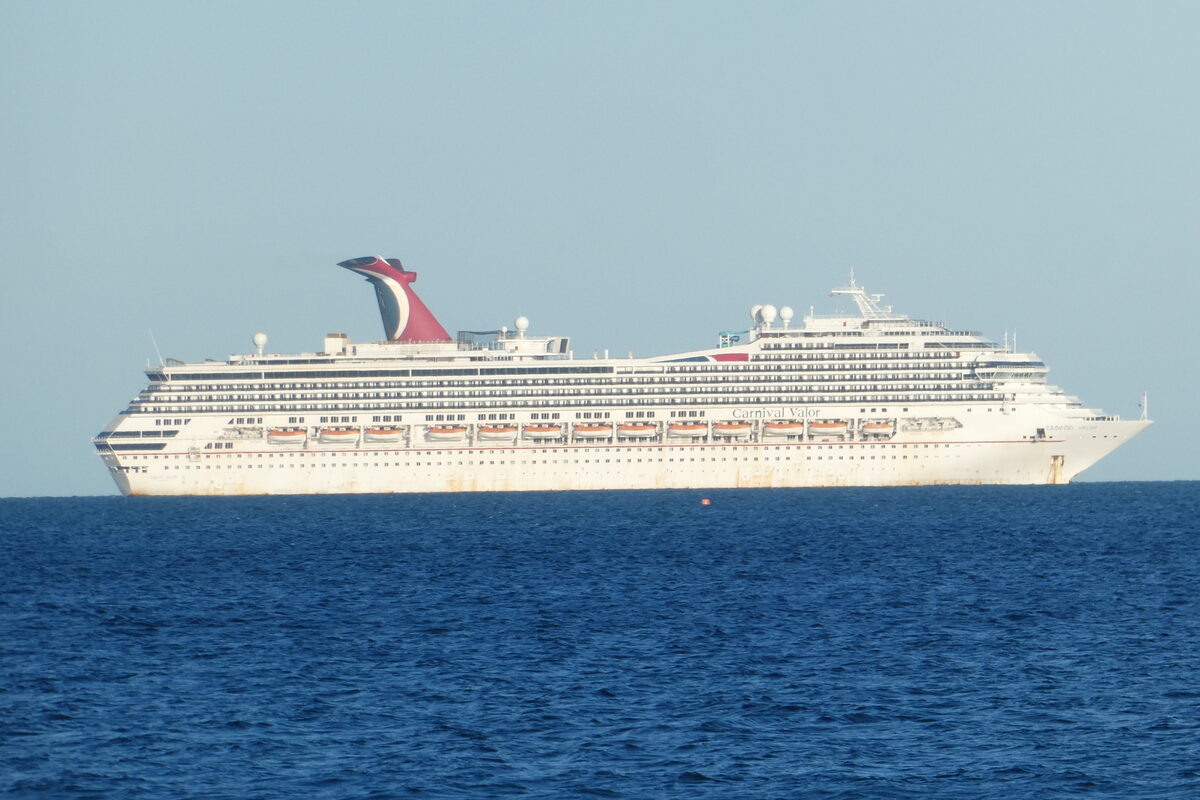 Carnival Valor cruise ship on open water with the Carnival funnel and white hull visible
