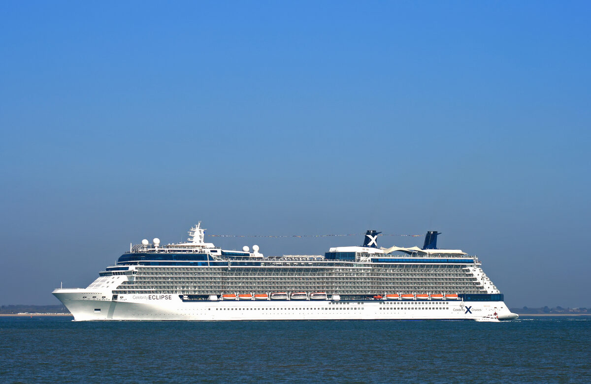 Celebrity Eclipse cruise ship under sail with Celebrity X logo on the funnel and Eclipse name on the hull