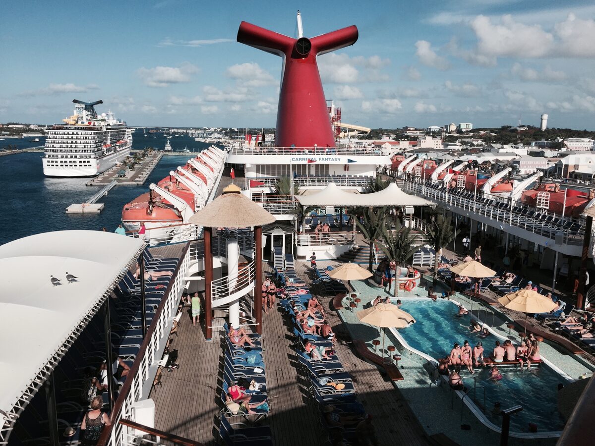 Passengers on the lido deck pool area of the Carnival Fantasy cruise ship